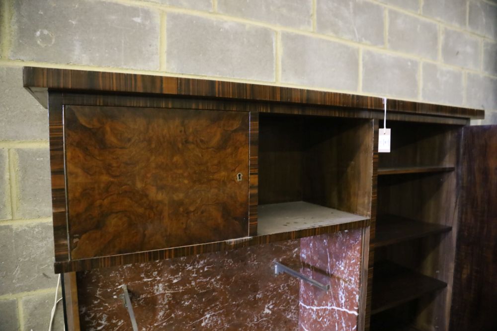 A Continental figured walnut marble inset side cabinet, W.200cm, D.50cm, H.173cm